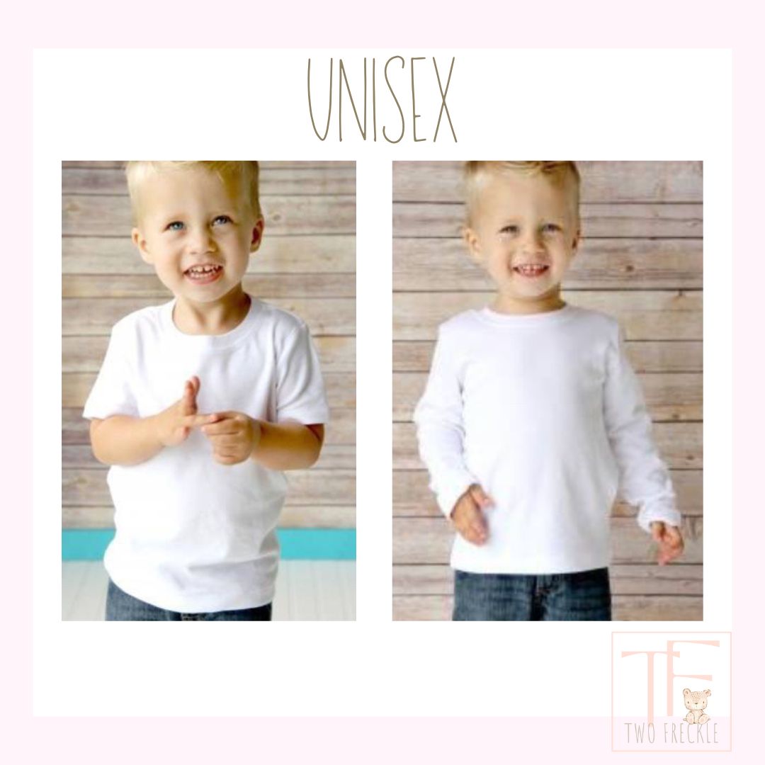 a little boy wearing a white shirt and jeans