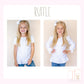 a little girl wearing a white ruffle top